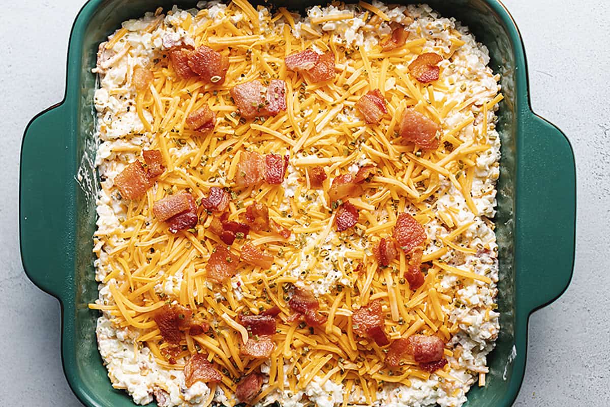 loaded cauliflower rice casserole in a dish before baking