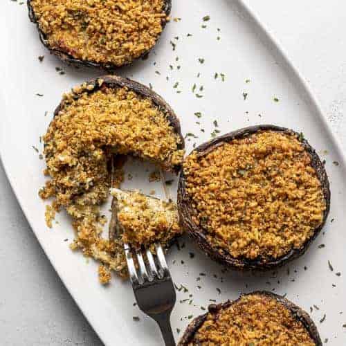 air fryer stuffed mushroom on a white platter