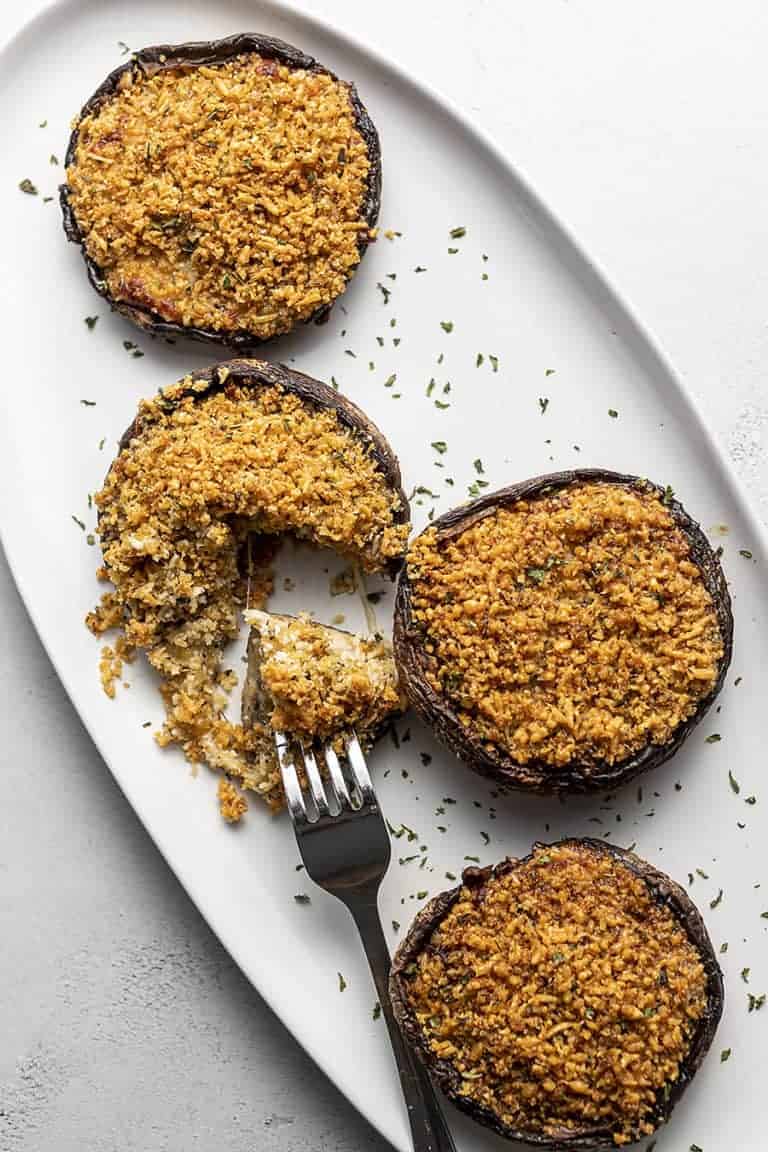 air fryer stuffed mushroom on a white platter