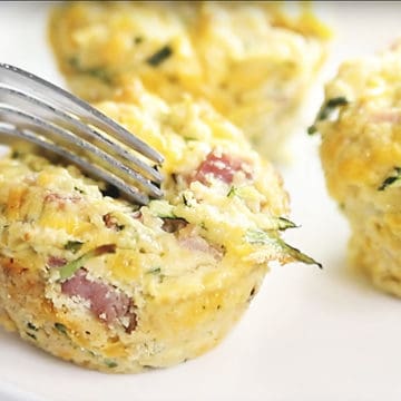 keto breakfast muffins being cut with a fork