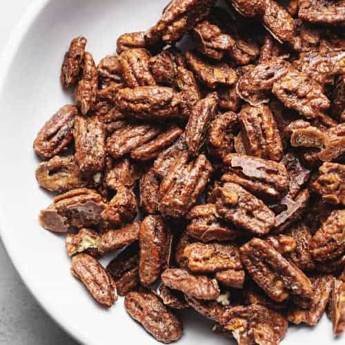 keto candied pecans in a white bowl