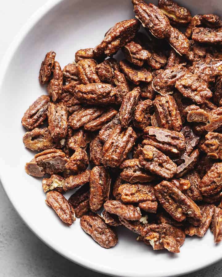 keto candied pecans in a white bowl