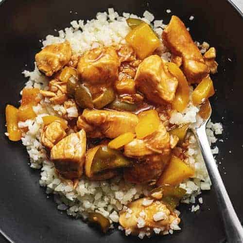 keto sweet and sour chicken in a black bowl