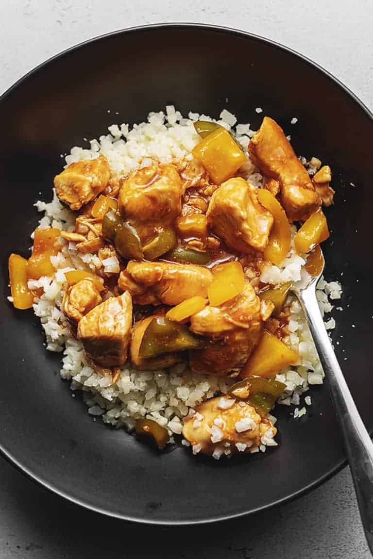 keto sweet and sour chicken in a black bowl