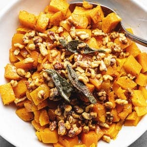 roasted butternut squash in a white glass bowl