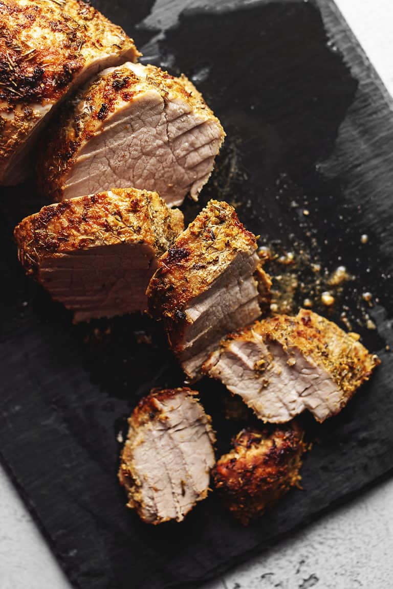 air fryer pork tenderloin cut on a black board