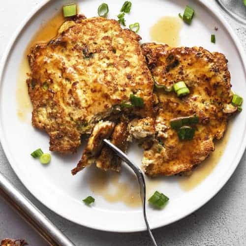 keto chicken egg foo young with gravy on a white plate