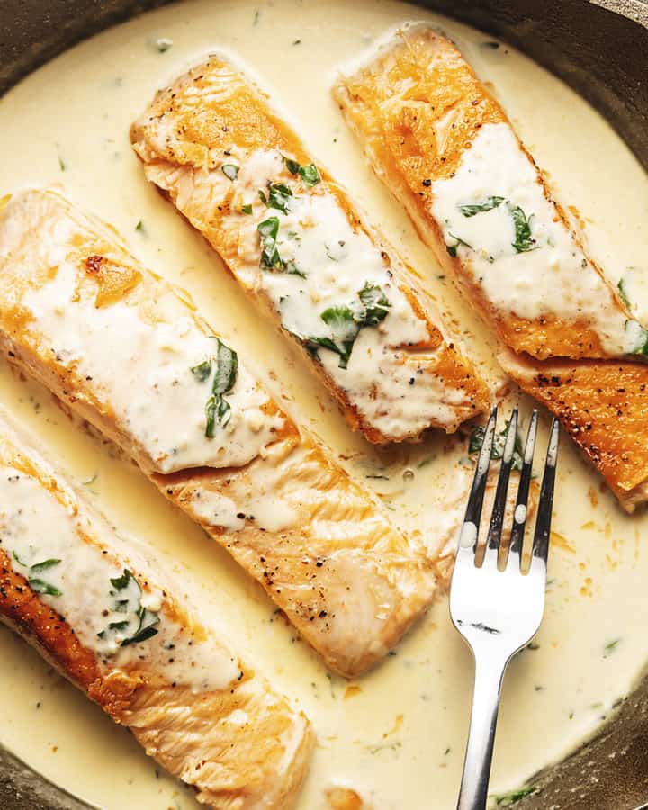 4 cooked salmon filets in a creamy sauce