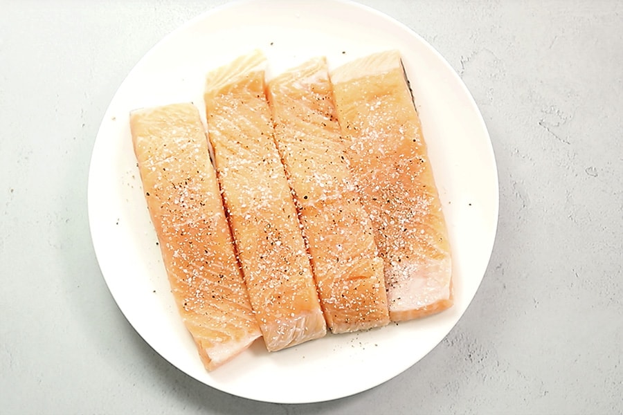raw salmon on a white platter