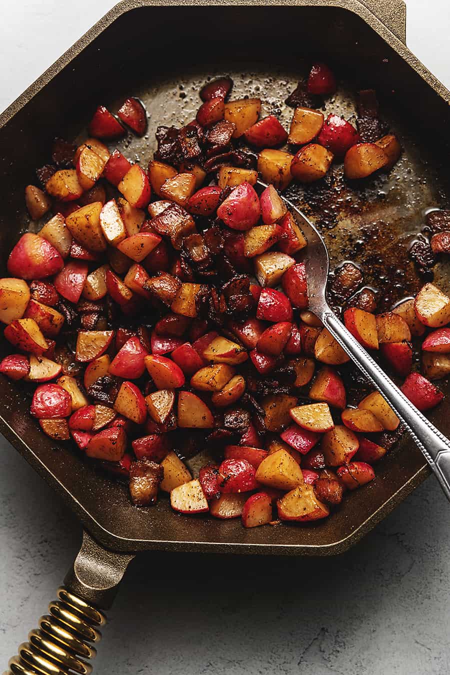 radishes with bacon in a cast iron skillet