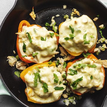 chicken Philly cheesesteak stuffed peppers in a blue skillet