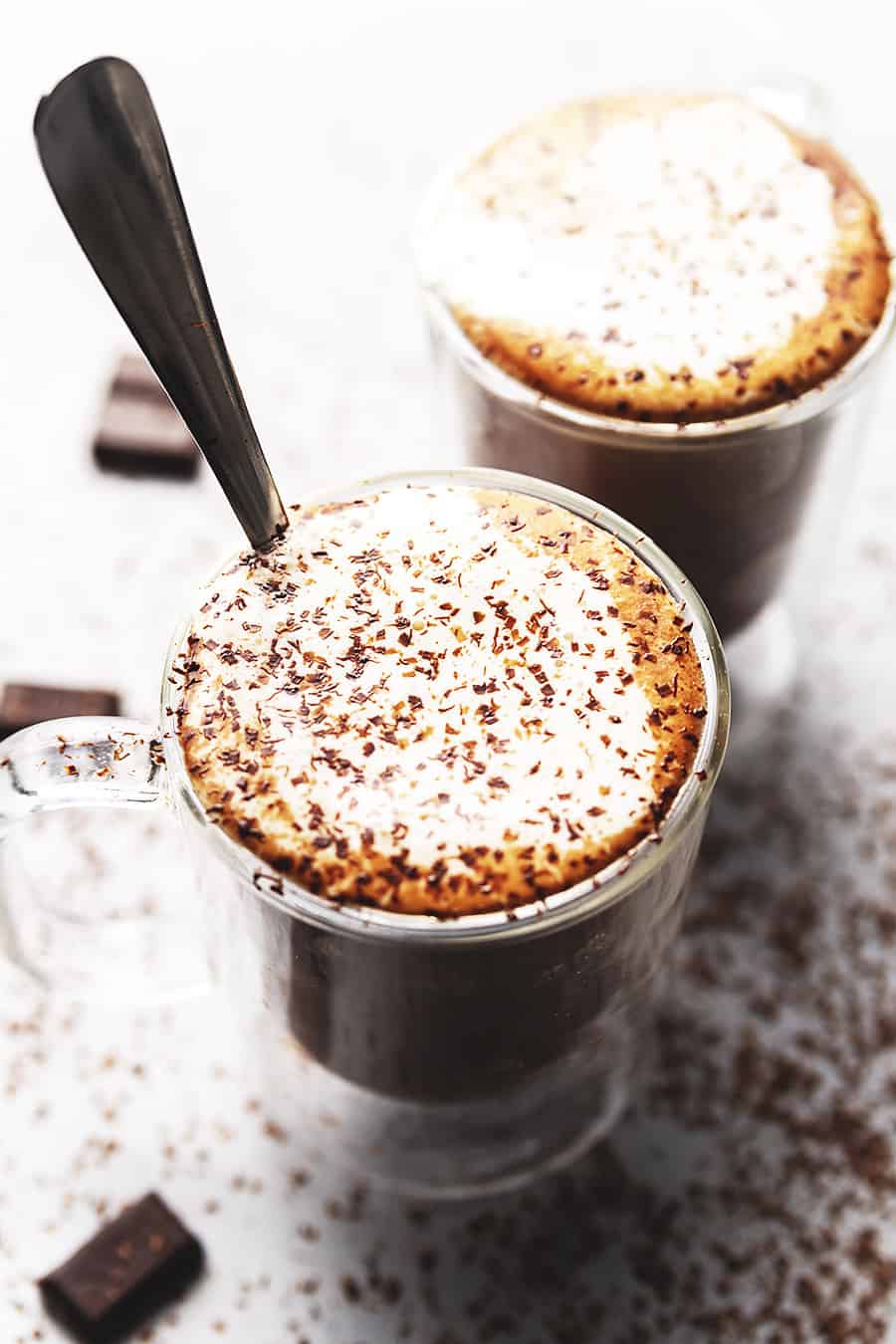 fancy hot chocolate in 2 clear mugs