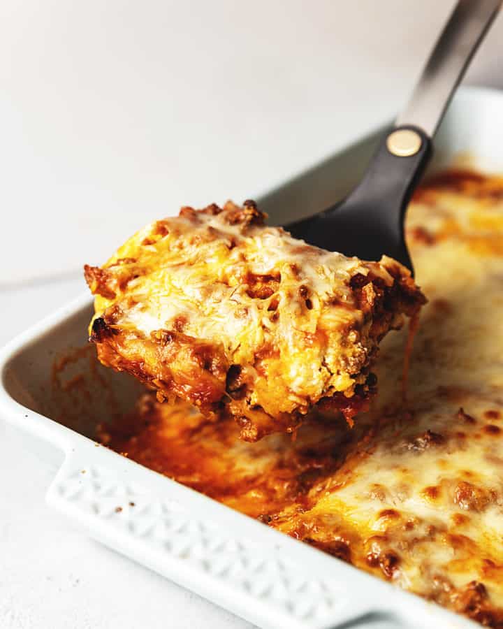 lasagna being served out of a dish