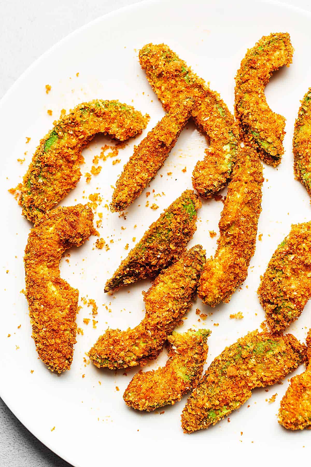 air fryer avocado fries on a white plate