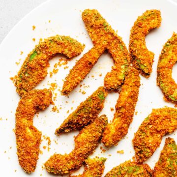 avocado fries cooked in the air fryer on a white plate