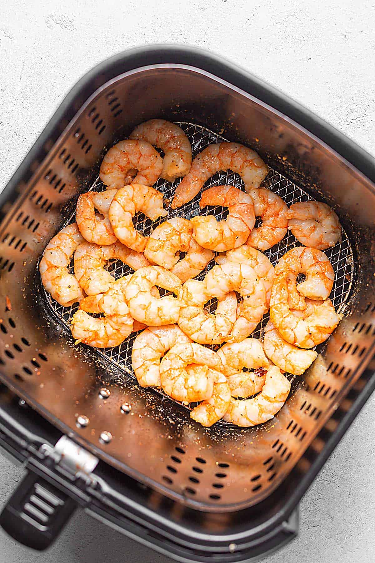 shrimp in an air fryer basket