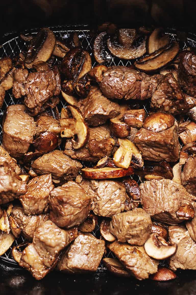 steak cubes and mushrooms in an air fryer