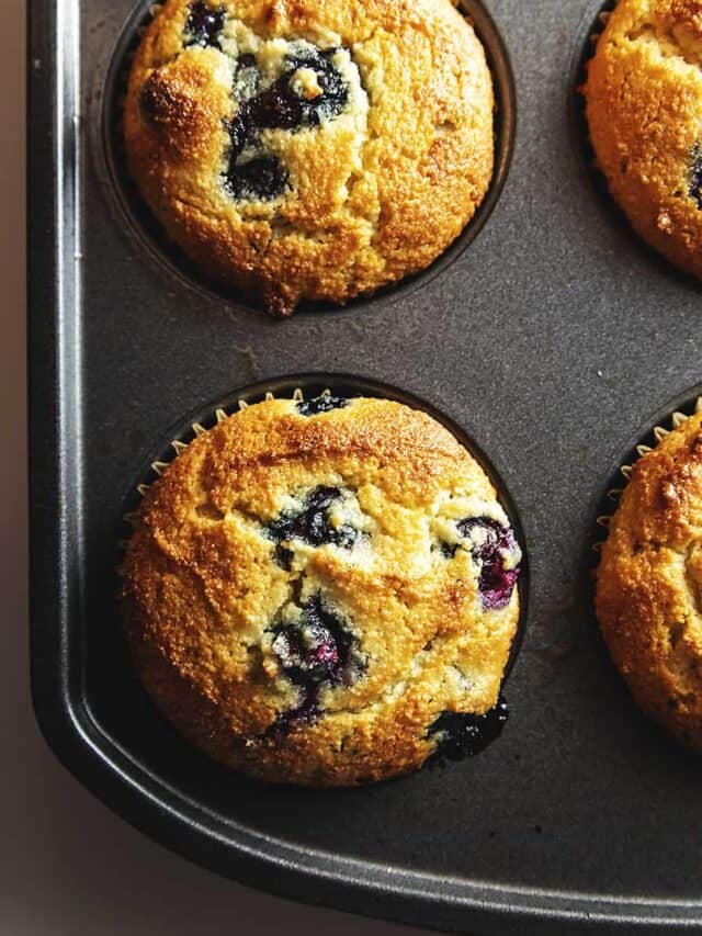 keto blueberry muffins in a muffin tin