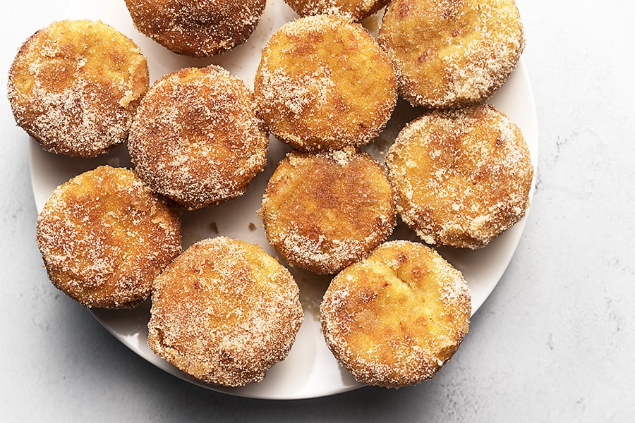 cinnamon sugar muffins on a white plate