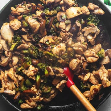 keto stir fry in a skillet with a red spatula