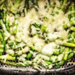 chopped asparagus covered with melted cheese