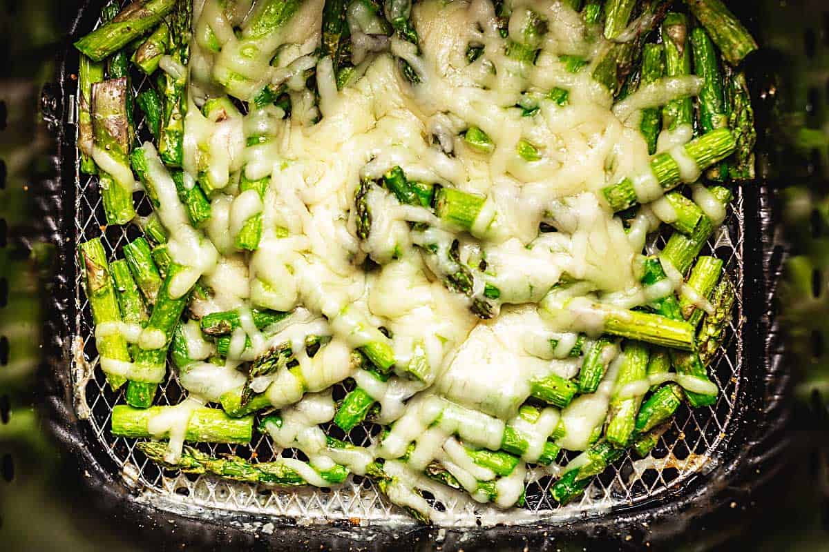 chopped asparagus covered with melted cheese