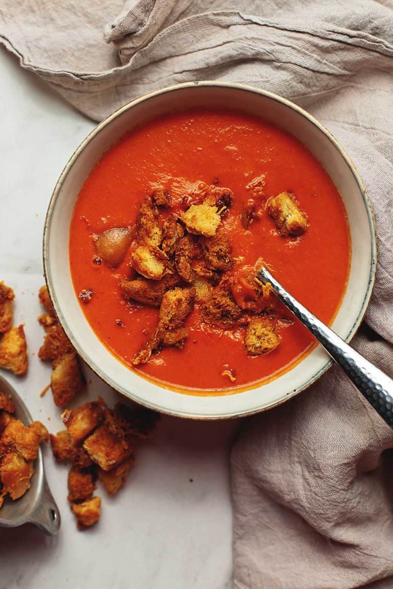 low carb creamy tomato soup with croutons in a bowl