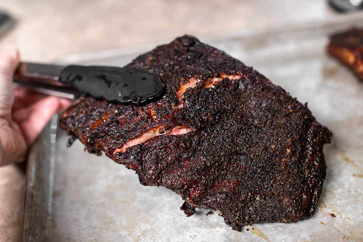 showing the bend test on a rack of smoked ribs