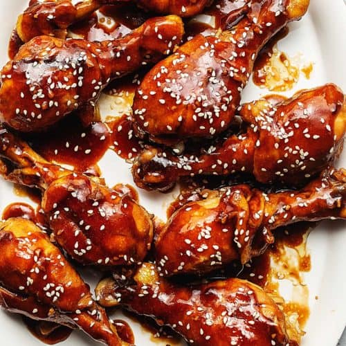 teriyaki chicken legs on a white plate
