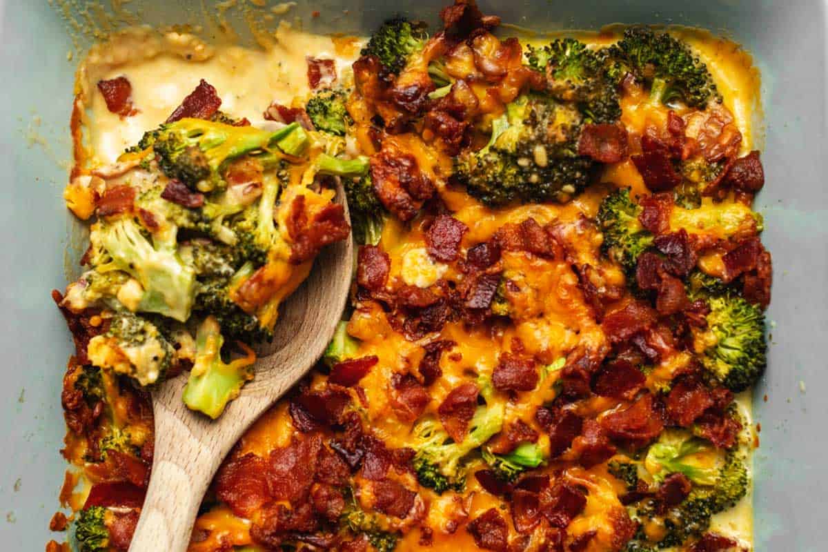 a wood spoon in broccoli casserole