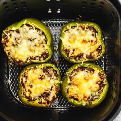 air fryer stuffed peppers being cooked