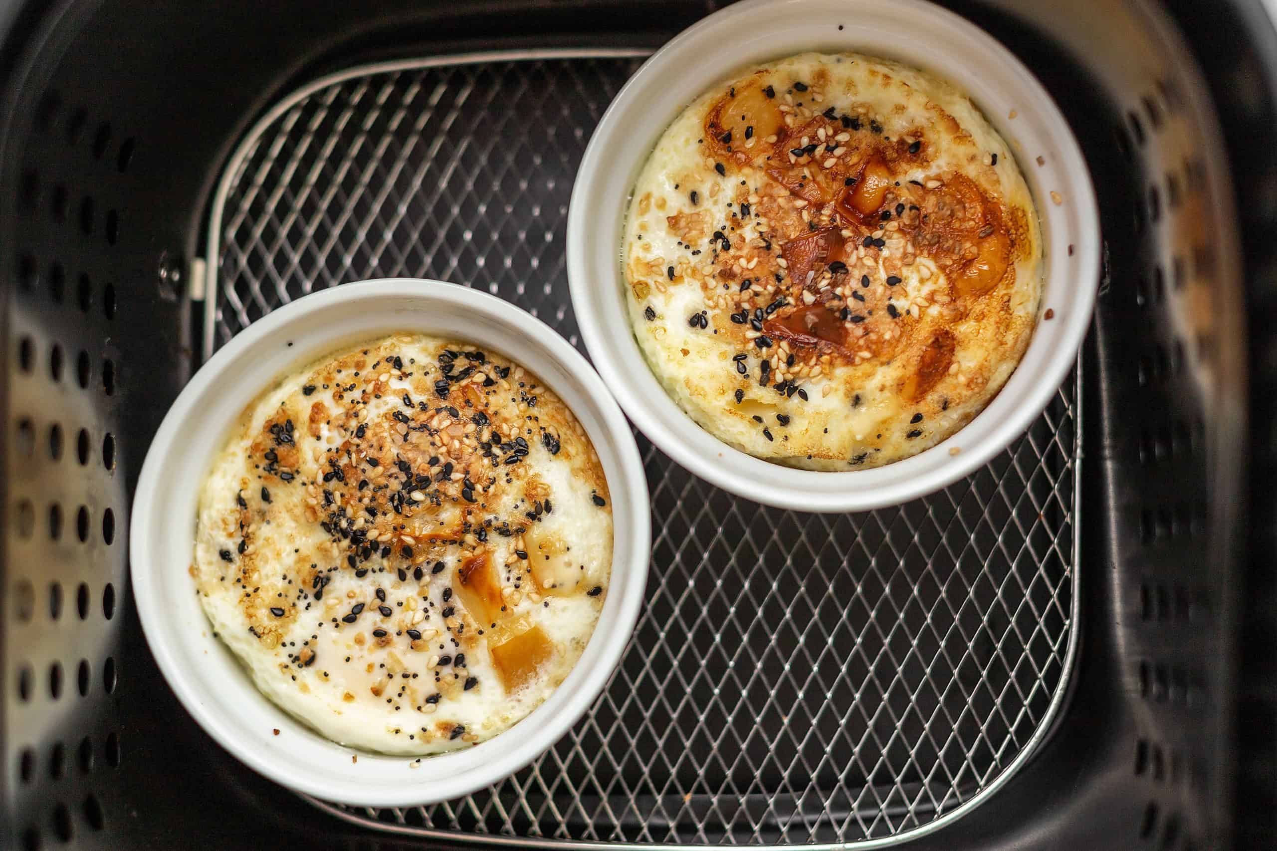 https://jenniferbanz.com/wp-content/uploads/2020/10/air-fryer-baked-eggs-recipe-image-scaled.jpg
