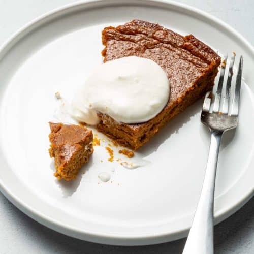 PUMPKIN PIE ON A WHITE PLATE