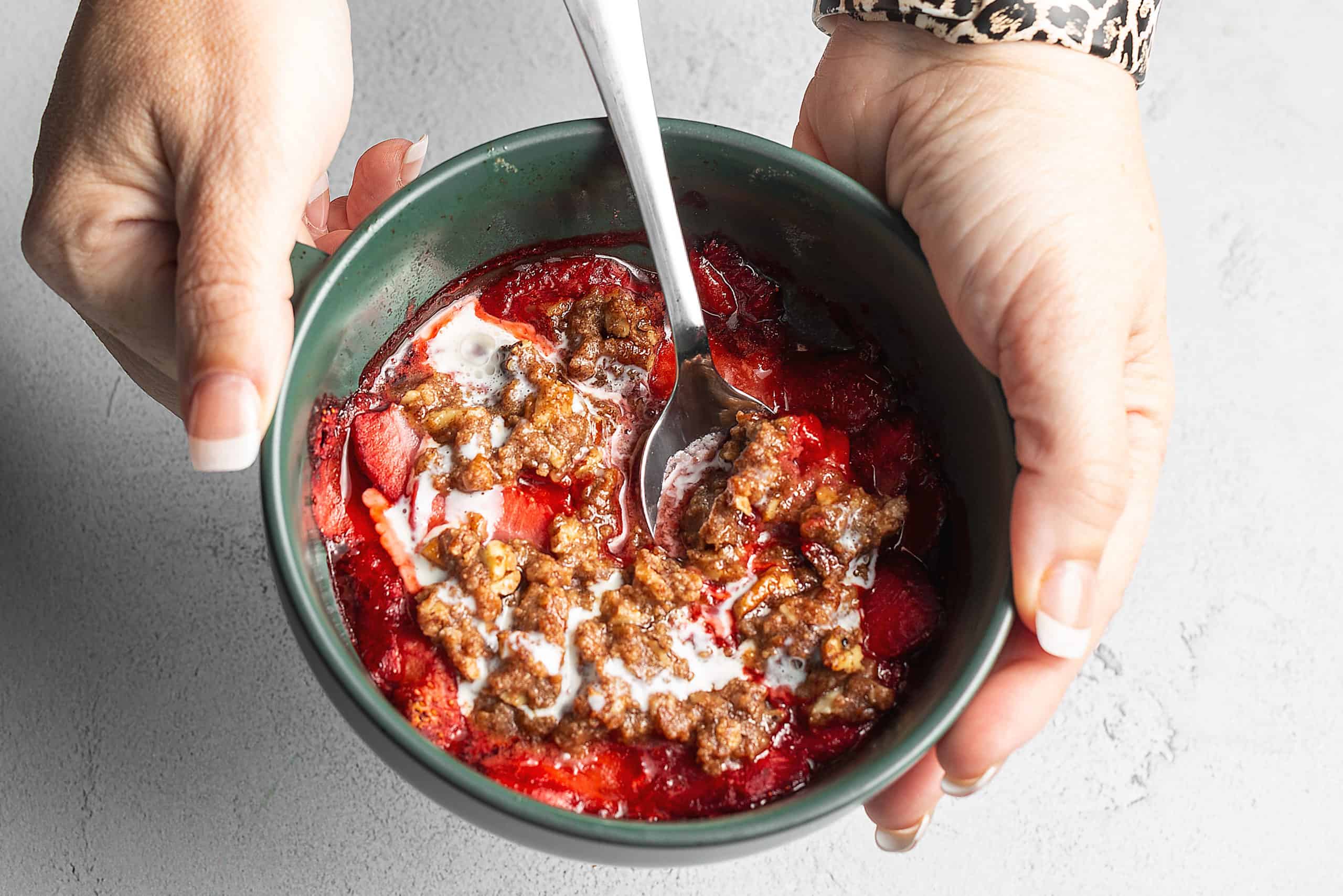 KETO STRAWBERRY CRISP IN A GREEN BOWL