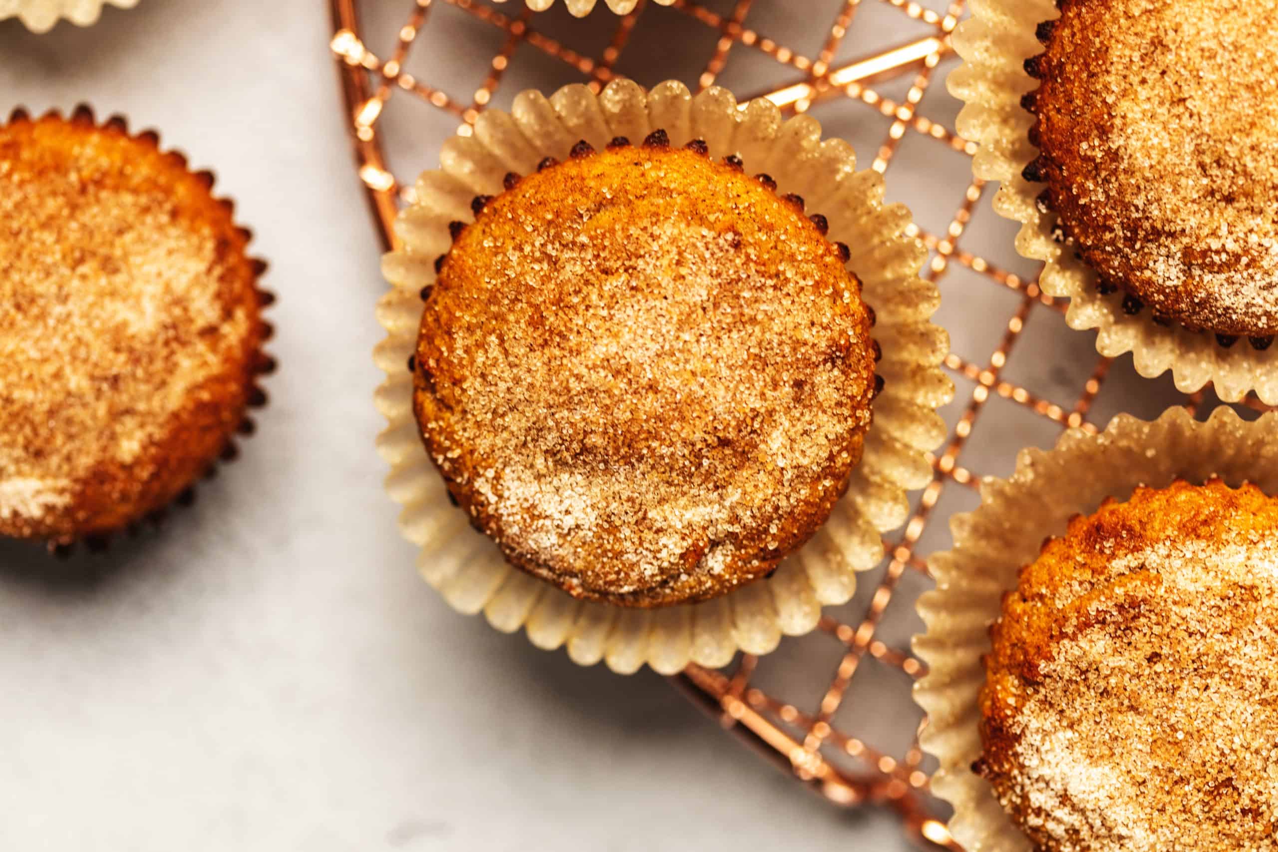 keto apple cider donut muffins on a tray