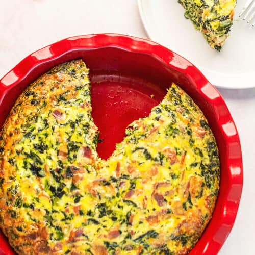 crustless quiche in a red pie plate