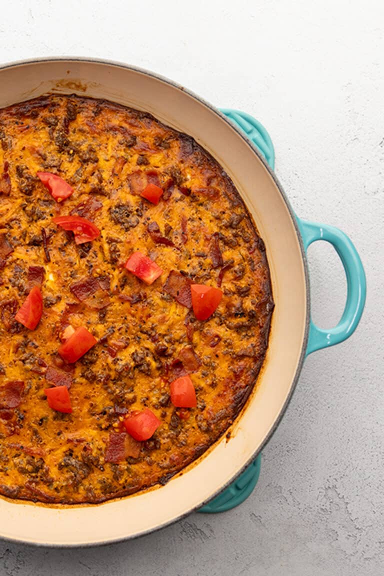 a blue skillet filled with cheeseburger casserole