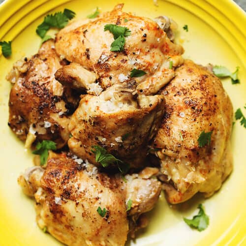 instant pot chicken thighs on a yellow plate