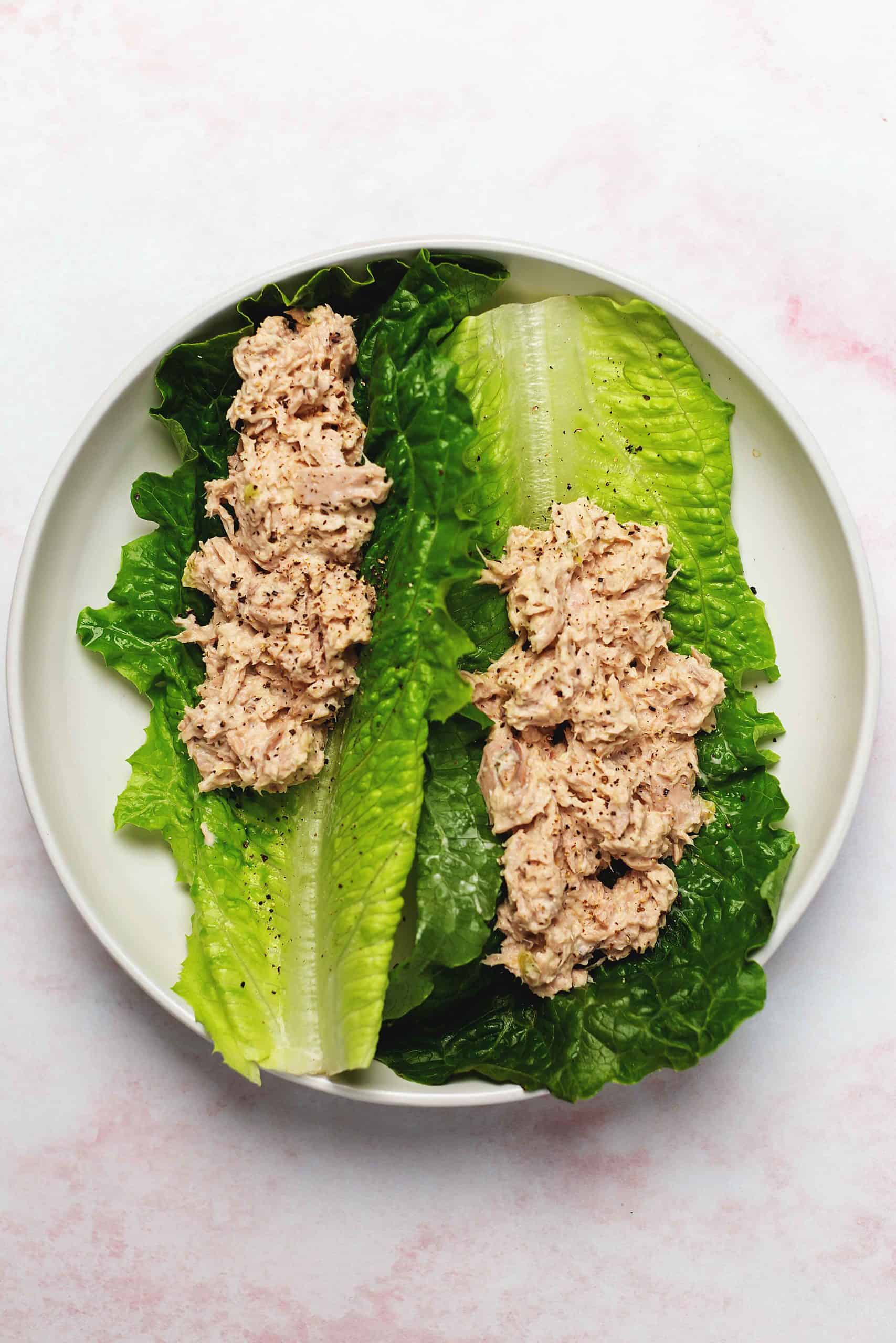 tuna salad lettuce wraps on a white plate