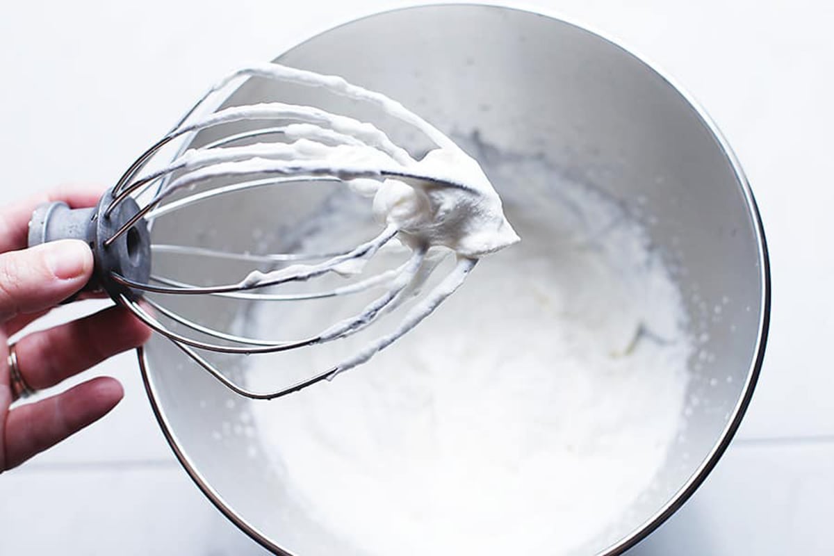 stiff peaks in whipped cream on a metal whisk