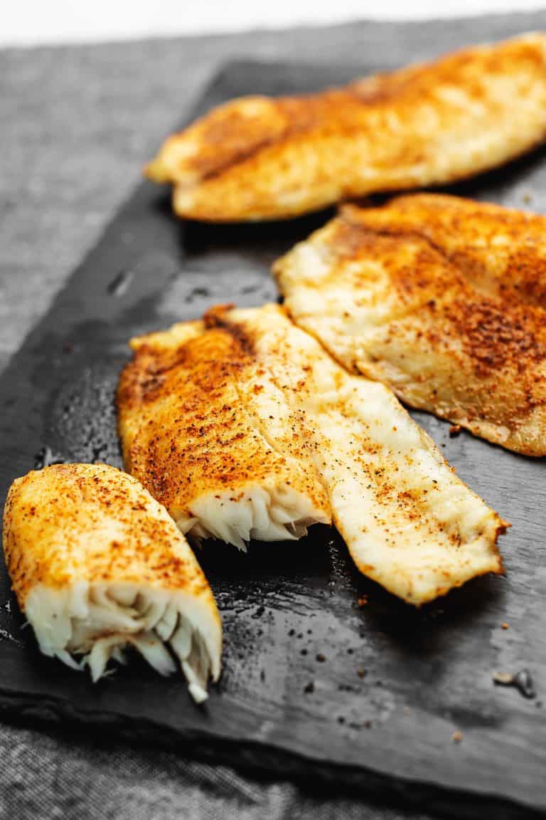 air fryer tilapia on a gray piece of slate