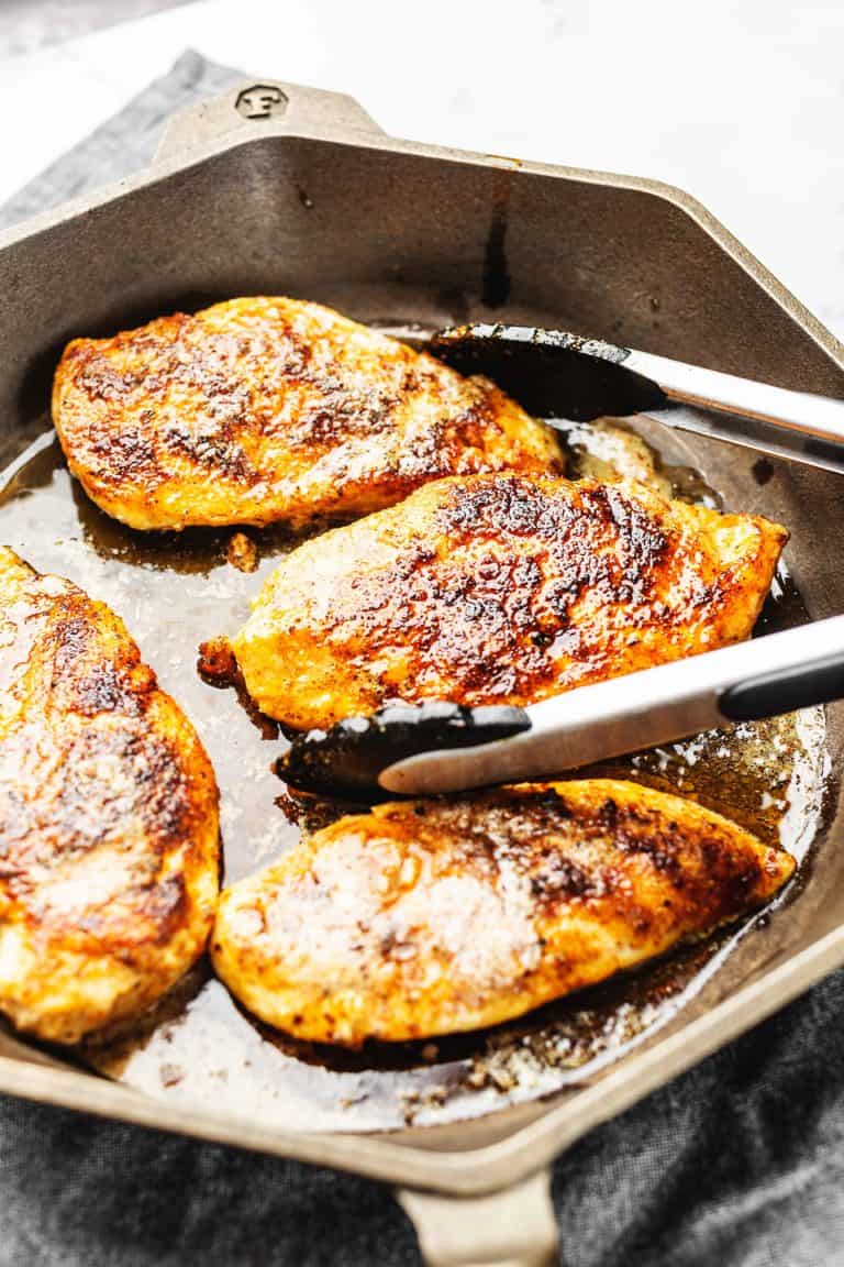 chicken breast cooked in a cast iron skillet