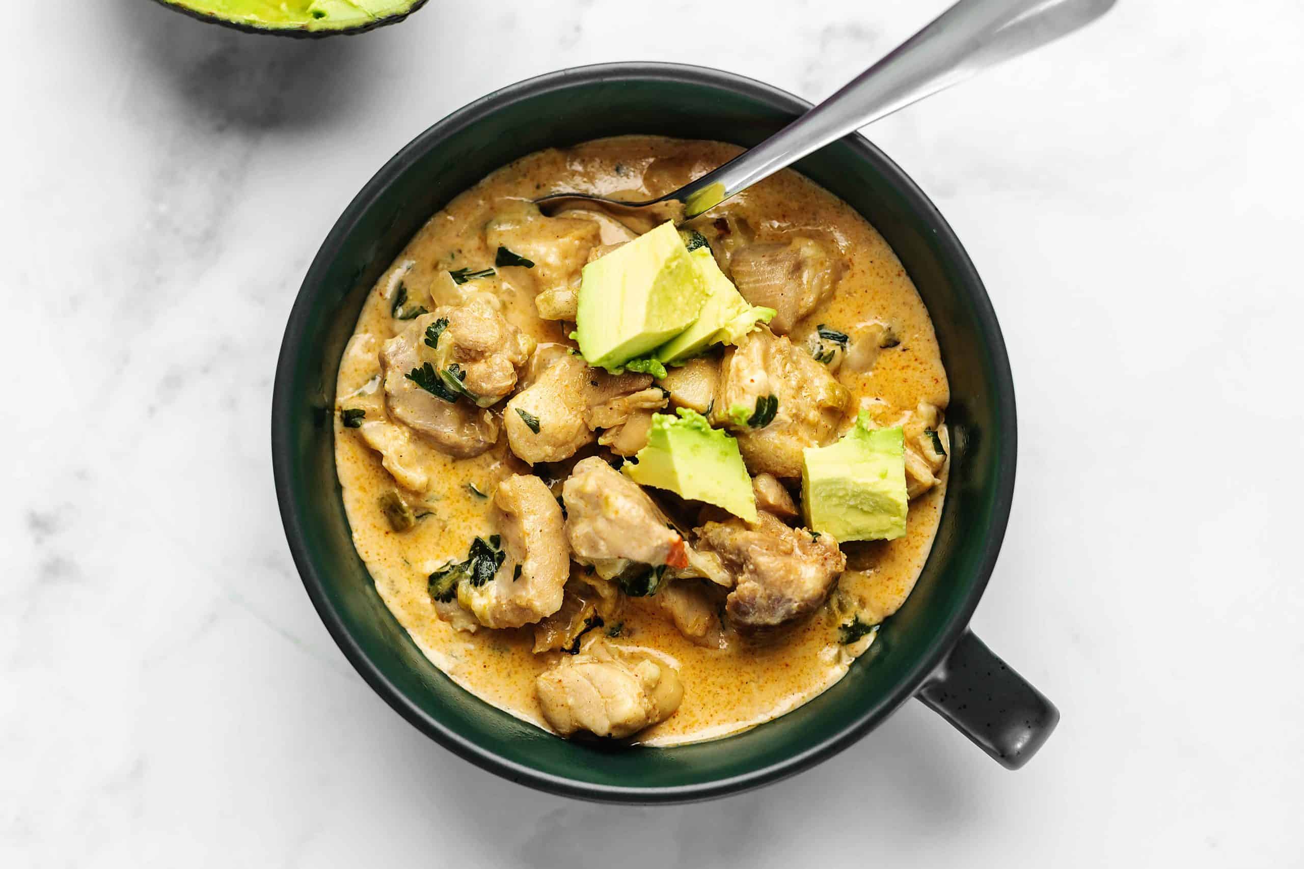 chicken chili in a green bowl
