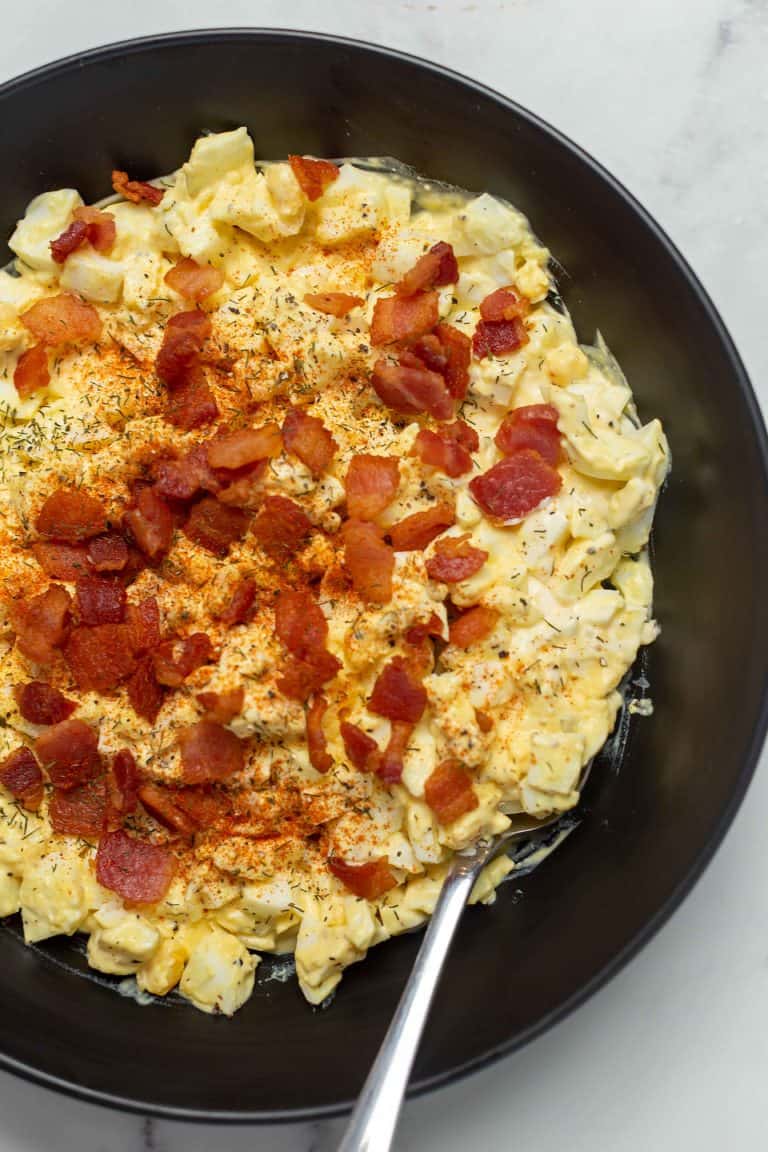 keto egg salad with bacon in a black bowl