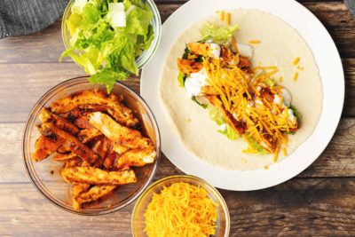 board of chicken wraps with buffalo sauce