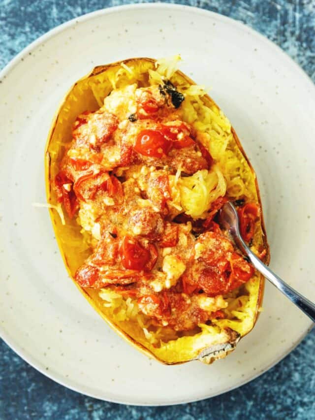 baked feta pasta on in spaghetti squash on a white plate