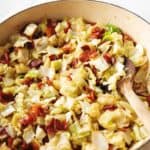 fried cabbage and bacon in a skillet