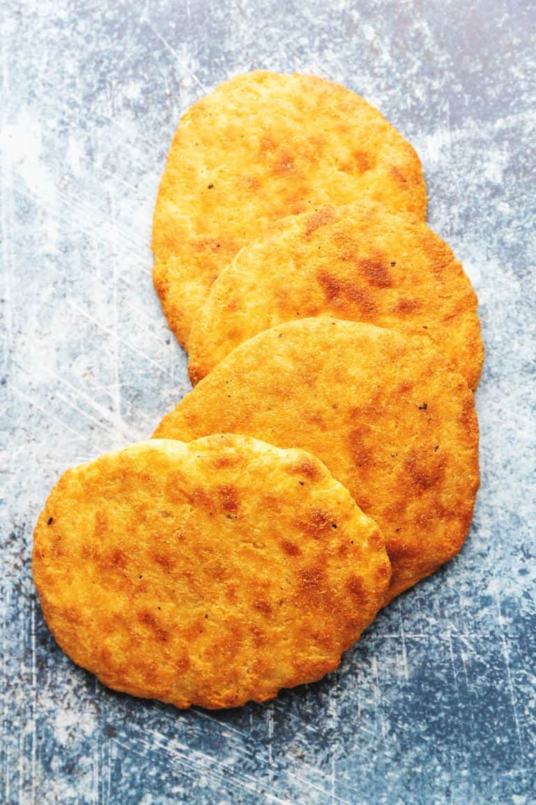 keto flatbread on a blue board