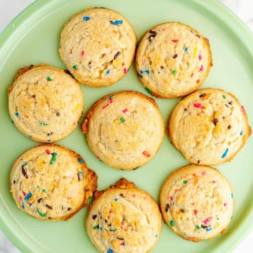 cookies with sprinkles on a green plate