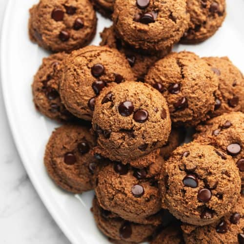 double chocolate protein cookies on a white plate